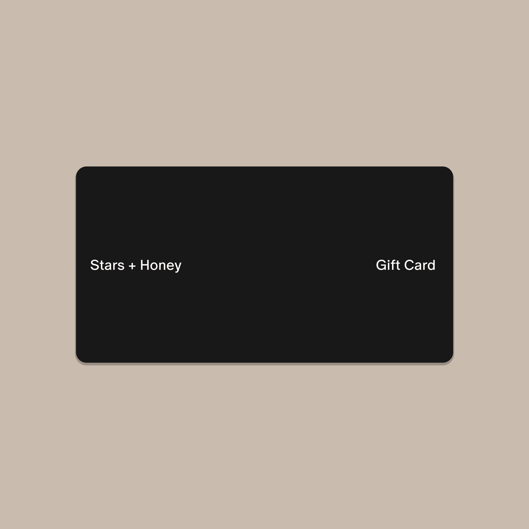 A black plastic gift card with 'Stars + Honey Gift Card' printed in white text.